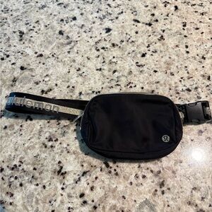 Lululemon everywhere, belt bag, black and gold logo strap Crossbody bag